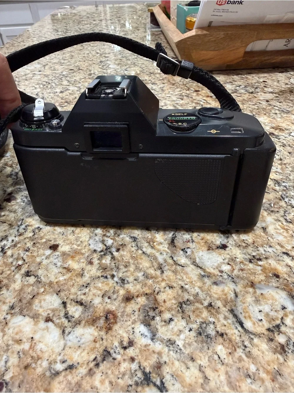 Canon T50 Black 35mm SLR Camera with Attached Lens
